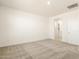 Cozy bedroom featuring soft carpet and a bathroom entry at 19406 N Fiano Dr, Maricopa, AZ 85138