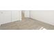 Bedroom featuring neutral carpet, white walls, closet and doorway, and ample natural light at 19406 N Fiano Dr, Maricopa, AZ 85138