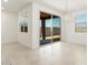 Bright dining area with sliding glass doors and modern chandelier at 19406 N Fiano Dr, Maricopa, AZ 85138