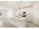 Modern kitchen featuring an island, stainless steel appliances, and pendant lighting at 19406 N Fiano Dr, Maricopa, AZ 85138