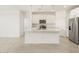 Spacious kitchen island with stainless steel appliances and white cabinetry at 19406 N Fiano Dr, Maricopa, AZ 85138
