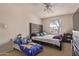 Cozy bedroom with carpet, queen bed, and colorful toddler bed at 19407 N 15Th Ave, Phoenix, AZ 85027