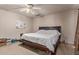 Bedroom with a ceiling fan, large bed and carpeted floors at 19407 N 15Th Ave, Phoenix, AZ 85027