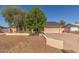 Charming single-story home with a two-car garage, neutral colors, and mature landscaping at 19407 N 15Th Ave, Phoenix, AZ 85027