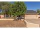 Charming single-story home with a two-car garage, neutral colors, and mature landscaping at 19407 N 15Th Ave, Phoenix, AZ 85027