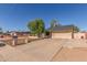 Charming single-story home with a two-car garage, neutral colors, and mature landscaping at 19407 N 15Th Ave, Phoenix, AZ 85027