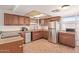 Cozy kitchen with wood cabinets, stainless steel appliances and a bright skylight at 19407 N 15Th Ave, Phoenix, AZ 85027