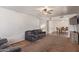 Cozy living room featuring a comfortable sofa and ceiling fan at 19407 N 15Th Ave, Phoenix, AZ 85027