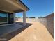 Spacious backyard with block fence, covered patio, and room for landscaping and outdoor activities at 19438 N Fiano Dr, Maricopa, AZ 85138