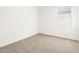 Bedroom with neutral carpet, featuring natural light from window at 19438 N Fiano Dr, Maricopa, AZ 85138