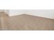 Expansive living space showcasing neutral tile flooring throughout, offering a blank canvas for personalization at 19438 N Fiano Dr, Maricopa, AZ 85138