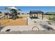 Community playground featuring slides, shade structures, and picnic area for outdoor enjoyment at 19438 N Fiano Dr, Maricopa, AZ 85138