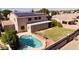 This backyard has a pool, a yard and solar panels on the roof at 2109 W Wildhorse Dr, Chandler, AZ 85286