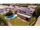 Aerial view of a property boasting solar panels, a pool, and a well-maintained lawn at 2109 W Wildhorse Dr, Chandler, AZ 85286