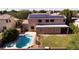 Aerial view of backyard pool, yard, solar panels on house at 2109 W Wildhorse Dr, Chandler, AZ 85286