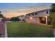 Private backyard featuring a pool, well-maintained lawn, and outdoor kitchen space at 2109 W Wildhorse Dr, Chandler, AZ 85286