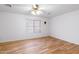 Cozy bedroom features hardwood floors, a ceiling fan, and lots of natural light at 2109 W Wildhorse Dr, Chandler, AZ 85286