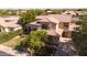 Charming two-story home featuring lush landscaping, a spacious driveway, and a welcoming facade at 2109 W Wildhorse Dr, Chandler, AZ 85286