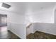 Upstairs hallway with wood floors and white walls providing access to bedrooms at 2109 W Wildhorse Dr, Chandler, AZ 85286