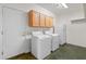 Functional laundry room with ample storage and modern appliances at 2109 W Wildhorse Dr, Chandler, AZ 85286
