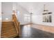 Bright living room features vaulted ceilings, large windows, and a staircase at 2109 W Wildhorse Dr, Chandler, AZ 85286