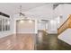 Spacious living room with archways, wood floors, and lots of natural light at 2109 W Wildhorse Dr, Chandler, AZ 85286