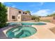 This backyard pool features a spa and plenty of space to entertain at 2109 W Wildhorse Dr, Chandler, AZ 85286