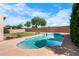 A backyard pool has a built-in spa and desert landscaping at 2109 W Wildhorse Dr, Chandler, AZ 85286