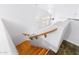 View from above the wooden staircase leading to the home's main living area at 2109 W Wildhorse Dr, Chandler, AZ 85286