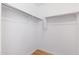 A spacious walk-in closet with minimalist design and ample storage space at 2109 W Wildhorse Dr, Chandler, AZ 85286