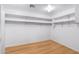 A spacious walk-in closet with minimalist design and ample storage space at 2109 W Wildhorse Dr, Chandler, AZ 85286