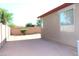 Spacious backyard, gravel ground, block fence, and corner view of the home at 21433 E Calle De Flores Ct, Queen Creek, AZ 85142