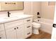Stylish bathroom featuring quartz counters, white shaker cabinets, and a modern tub with hexagon tile surround at 21433 E Calle De Flores Ct, Queen Creek, AZ 85142
