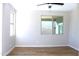 Bedroom with wood flooring and lots of light at 21433 E Calle De Flores Ct, Queen Creek, AZ 85142