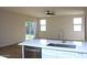 Open kitchen featuring a large island, modern countertops and wood flooring at 21433 E Calle De Flores Ct, Queen Creek, AZ 85142