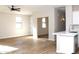 Open-concept living area showcasing new wood flooring and modern neutral paint at 21433 E Calle De Flores Ct, Queen Creek, AZ 85142