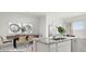 Modern kitchen featuring granite countertops, stainless steel sink, and an open layout to the dining area at 2317 S 125Th Dr, Avondale, AZ 85323