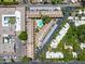 Aerial view of townhome community featuring a shared pool, parking, lush landscape, and flat roofs at 2946 N 14Th St # 3, Phoenix, AZ 85014