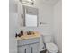 Half-bathroom with marble vanity, black hardware, and stylish features at 2946 N 14Th St # 3, Phoenix, AZ 85014