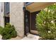 Front entrance with wrought iron gate and mature landscaping at 2946 N 14Th St # 3, Phoenix, AZ 85014