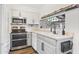 Well-lit kitchen offers stainless steel appliances, modern cabinetry, and tiled backsplash at 2946 N 14Th St # 3, Phoenix, AZ 85014