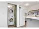 Bright kitchen with stainless steel appliances, laundry closet, and white cabinetry at 2946 N 14Th St # 3, Phoenix, AZ 85014