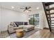 Cozy living room featuring modern ceiling fan, wood floors, and comfortable sectional at 2946 N 14Th St # 3, Phoenix, AZ 85014