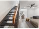 Inviting living room featuring a staircase and open floor plan to the dining area and kitchen at 2946 N 14Th St # 3, Phoenix, AZ 85014