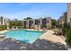 Community pool surrounded by lounge chairs and lush landscaping at 2946 N 14Th St # 3, Phoenix, AZ 85014