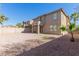 This home features a spacious backyard with desert landscaping and a covered patio at 3064 E Michelle Way, Gilbert, AZ 85234