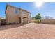 Expansive backyard with desert landscaping and covered patio at 3064 E Michelle Way, Gilbert, AZ 85234