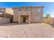 A large backyard has desert landscaping and a covered patio at 3064 E Michelle Way, Gilbert, AZ 85234