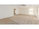 Large bedroom with neutral carpet, light walls, a ceiling fan, and curtains at 3064 E Michelle Way, Gilbert, AZ 85234