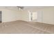 Bedroom featuring neutral carpet, light-colored walls, a ceiling fan, and several doorways at 3064 E Michelle Way, Gilbert, AZ 85234